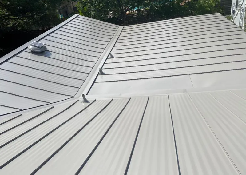 Solar attic fan installed on a metal roof for Roof Ventilation in Ahuimanu